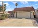 Charming home featuring a terracotta tile roof and a spacious two-car garage, enhancing curb appeal at 1619 Abby Ave, Henderson, NV 89014