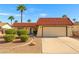 Charming single-story home featuring a red tile roof, desert landscaping, and a spacious two-car garage at 1619 Abby Ave, Henderson, NV 89014