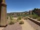 Expansive backyard view showcases desert landscaping with mountain views at 18 Brookridge Dr, Henderson, NV 89052