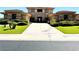 Home exterior with a stone facade, well-manicured bushes and lawn at 18 Brookridge Dr, Henderson, NV 89052