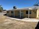 Expansive backyard with a covered patio and room for outdoor entertaining and recreation at 1809 Lamplighter Ln, Las Vegas, NV 89104