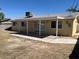 Rear of property featuring covered patio and low maintenance yard at 1809 Lamplighter Ln, Las Vegas, NV 89104