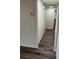 Hallway featuring a closet, thermostat, and continuous wood flooring that connects to the home at 1809 Lamplighter Ln, Las Vegas, NV 89104