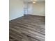 Inviting living room featuring new wood flooring, neutral walls and entry to kitchen at 1809 Lamplighter Ln, Las Vegas, NV 89104