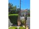 Exterior view of the building with security cameras, professional landscaping, and ample parking at 1908 Rio Canyon Ct # 105, Las Vegas, NV 89128