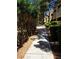 Shaded community walkway with trimmed hedges and mature trees create a tranquil and inviting path at 1908 Rio Canyon Ct # 105, Las Vegas, NV 89128