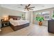 Spacious bedroom featuring natural light from multiple windows and wood-look flooring at 2084 Airy Petals Walk, Henderson, NV 89044