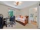 Cozy bedroom with a daybed, study desk, and an en suite bathroom at 2084 Airy Petals Walk, Henderson, NV 89044