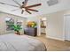 Bedroom showcasing an entertainment center and a view of an en suite bathroom at 2084 Airy Petals Walk, Henderson, NV 89044