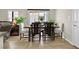 Cozy dining area with a rustic wooden table, comfortable seating, and plenty of natural light, great for Gathering meals at 2084 Airy Petals Walk, Henderson, NV 89044