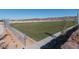 Well-maintained dog park with lush green grass, secure fencing, and convenient walking paths for community residents at 2084 Airy Petals Walk, Henderson, NV 89044