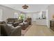 Open-concept living area featuring sleek floors, modern furnishings, and ample natural light perfect for relaxing and entertaining at 2084 Airy Petals Walk, Henderson, NV 89044