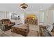 Inviting living space with an open layout, stylish decor, and seamless access to the kitchen, ideal for modern living at 2084 Airy Petals Walk, Henderson, NV 89044