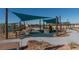 Modern playground with sunshades, climbing structures, and soft play surfaces in a well-maintained park at 2084 Airy Petals Walk, Henderson, NV 89044