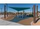Community playground featuring modern play structures with sunshade and soft, cushioned ground for safe and fun activities at 2084 Airy Petals Walk, Henderson, NV 89044