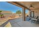Spacious covered back patio has ample seating, with a fan for relaxing, perfect for outdoor living at 2217 Merrimack Valley Ave, Henderson, NV 89044