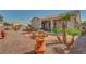 The backyard features a covered patio and inviting seating area, perfect for relaxation and outdoor entertaining at 2217 Merrimack Valley Ave, Henderson, NV 89044