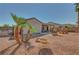A spacious backyard offers a covered patio and outdoor seating, ideal for entertaining at 2217 Merrimack Valley Ave, Henderson, NV 89044