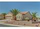 Lovely home featuring desert landscaping with palm trees and a decorative stone retaining wall at 2217 Merrimack Valley Ave, Henderson, NV 89044