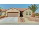 Charming single-story home with a well-manicured front yard and a spacious two-car garage at 2217 Merrimack Valley Ave, Henderson, NV 89044