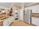 Modern kitchen featuring stainless steel appliances, granite counters, and white cabinets at 2217 Merrimack Valley Ave, Henderson, NV 89044