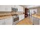 Updated kitchen showcasing stainless steel appliances, granite countertops, and white cabinets at 2217 Merrimack Valley Ave, Henderson, NV 89044