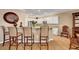 Kitchen with granite countertops, a breakfast bar with seating, and white cabinetry at 2217 Merrimack Valley Ave, Henderson, NV 89044