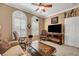 Well lit living room with crown molding, neutral tones, and comfortable seating arrangement at 2217 Merrimack Valley Ave, Henderson, NV 89044