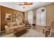 Cozy living room with crown molding, neutral tones, and comfortable seating arrangement at 2217 Merrimack Valley Ave, Henderson, NV 89044