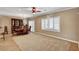 Spacious living room with a neutral color palette, plush carpet, and plantation shutters at 2217 Merrimack Valley Ave, Henderson, NV 89044