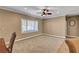 Well-lit living space featuring a large window with plantation shutters and neutral decor at 2217 Merrimack Valley Ave, Henderson, NV 89044