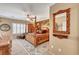 Spacious bedroom with a four-poster bed, hardwood furniture, carpet flooring, and shuttered windows at 2217 Merrimack Valley Ave, Henderson, NV 89044