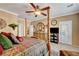 Spacious bedroom with a four-poster bed and an ensuite bathroom at 2217 Merrimack Valley Ave, Henderson, NV 89044