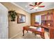 Cozy home office with hardwood desk and chair and a decorative plant at 2217 Merrimack Valley Ave, Henderson, NV 89044