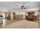 Bright, open floor plan with kitchen island seating, dining area, and large living space at 2217 Merrimack Valley Ave, Henderson, NV 89044