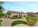 Well-maintained backyard featuring artificial turf, rock landscaping, and mature trees, ideal for relaxation at 2766 Mintlaw Ave, Henderson, NV 89044