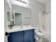 Bright bathroom features a toilet, bath and shower, vanity, and stylish tile flooring at 2766 Mintlaw Ave, Henderson, NV 89044