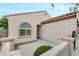 Inviting entrance with covered porch, tiled roof, and desert landscaping in a well-maintained front yard at 2766 Mintlaw Ave, Henderson, NV 89044