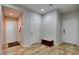 Bright foyer featuring wood flooring, white walls, and multiple doors for closet and room access at 2766 Mintlaw Ave, Henderson, NV 89044