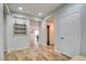 Bright foyer featuring wood flooring, white walls, and multiple doors for closet and room access at 2766 Mintlaw Ave, Henderson, NV 89044