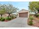 Charming single-story home with desert landscaping and a two-car garage on a sunny day at 2766 Mintlaw Ave, Henderson, NV 89044