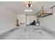 Spacious garage with overhead storage racks, ample room for parking and organizing tools and equipment at 2766 Mintlaw Ave, Henderson, NV 89044