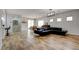 Spacious living room with wood flooring, recessed lighting, and plenty of natural light from sliding glass doors at 2766 Mintlaw Ave, Henderson, NV 89044