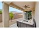 Cozy covered patio with comfortable wicker furniture and a view of the well-maintained backyard at 2766 Mintlaw Ave, Henderson, NV 89044