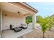 Inviting covered patio with comfortable seating, ideal for outdoor relaxation and entertaining guests at 2766 Mintlaw Ave, Henderson, NV 89044