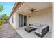 Charming covered patio with wicker furniture and a tranquil outdoor seating area, perfect for relaxation at 2766 Mintlaw Ave, Henderson, NV 89044