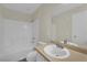Bathroom features a white vanity, large mirror and shower-tub combo with tile surround at 3182 Tarpon Dr # 204, Las Vegas, NV 89120