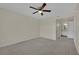 Spacious carpeted bedroom with ceiling fan, ample closet space, and neutral color palette at 3182 Tarpon Dr # 204, Las Vegas, NV 89120