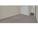 Bright bedroom with neutral walls, plush carpeting, and a closet for ample storage space at 3182 Tarpon Dr # 204, Las Vegas, NV 89120