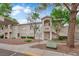 Inviting condo building with well-maintained landscaping, accessible parking, and charming exterior details at 3182 Tarpon Dr # 204, Las Vegas, NV 89120